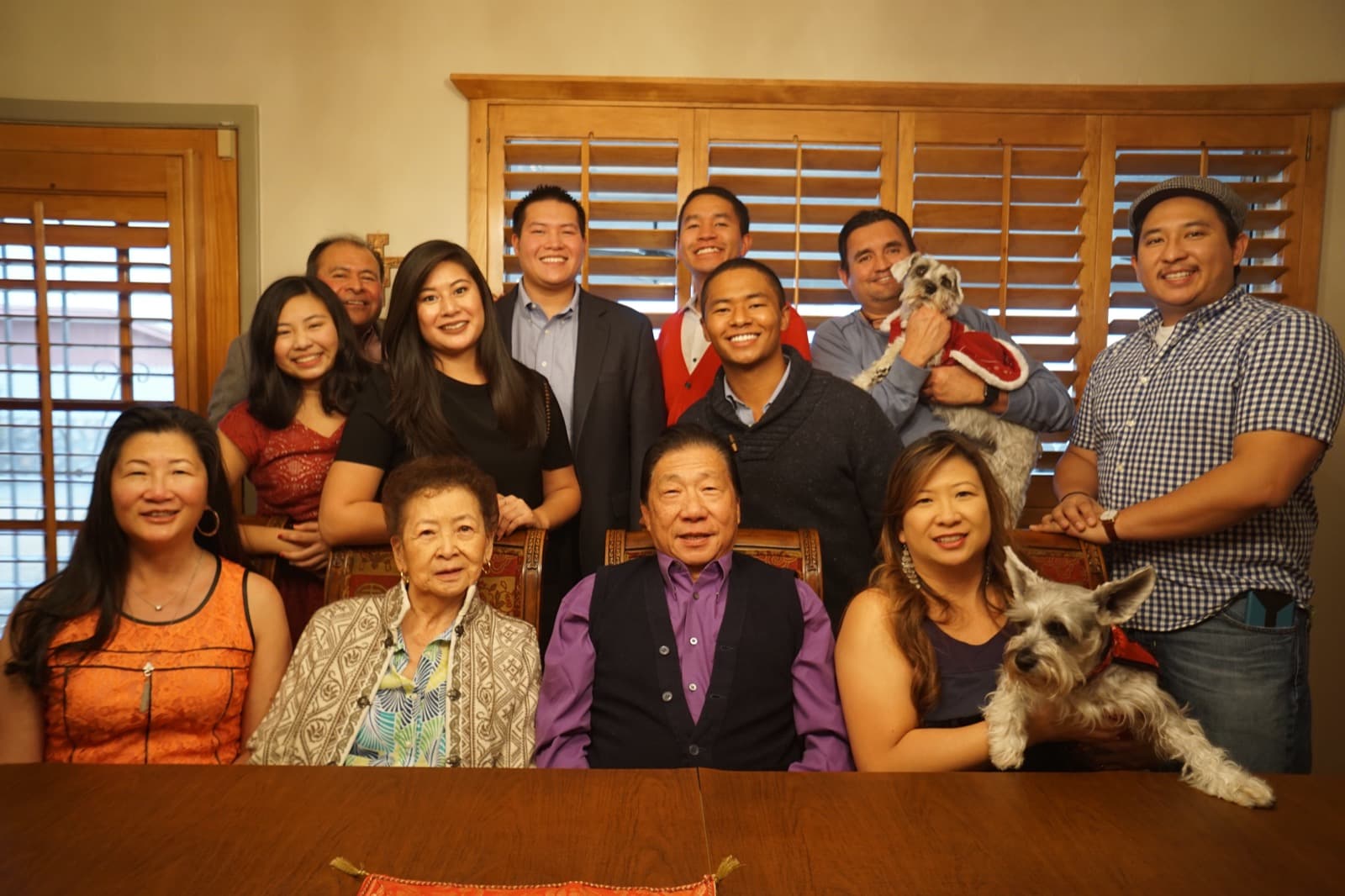 Three generations of the Yee family gathered around the dining table at Christmas